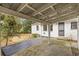 Covered patio area with wood and concrete surfaces, perfect for outdoor enjoyment at 1631 Dresden Ne Dr, Brookhaven, GA 30319
