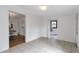 Spacious room with tiled floors, bright lighting, and views of other rooms at 1631 Dresden Ne Dr, Brookhaven, GA 30319
