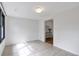 Open room with tiled floor, natural light, and view of dining room at 1631 Dresden Ne Dr, Brookhaven, GA 30319