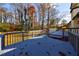 Wrap-around back deck with a view of the property and blue door entry to the home at 175 Jayne Ellen Way, Alpharetta, GA 30009