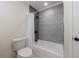 Cozy bathroom showcases a tub with decorative tiling and neutral-toned walls at 175 Jayne Ellen Way, Alpharetta, GA 30009