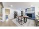Dining room with fireplace, modern furniture, and ample natural light at 175 Jayne Ellen Way, Alpharetta, GA 30009