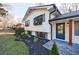 Charming home featuring manicured lawn, new landscaping, and modern windows at 175 Jayne Ellen Way, Alpharetta, GA 30009