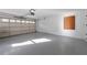Spacious two-car garage with painted walls, overhead lighting, and ample room for storage at 175 Jayne Ellen Way, Alpharetta, GA 30009