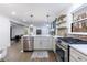Open concept kitchen with stainless steel appliances, island seating, and modern finishes at 175 Jayne Ellen Way, Alpharetta, GA 30009