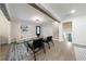 Inviting living room with hardwood floors, neutral tones, wood beams, and access to the stairway and basement at 175 Jayne Ellen Way, Alpharetta, GA 30009