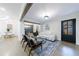 Bright living space showcasing hardwood floors, comfortable seating, and an open layout with dining area views at 175 Jayne Ellen Way, Alpharetta, GA 30009