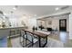 Open-concept living space with modern finishes, including hardwood floors and designer lighting at 175 Jayne Ellen Way, Alpharetta, GA 30009
