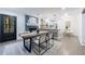 Open concept with dining, living room, and kitchen, featuring modern design and natural light at 175 Jayne Ellen Way, Alpharetta, GA 30009