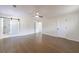 Spacious main bedroom featuring sleek hardwood floors, ceiling fan, and a sliding barn door to the bathroom at 175 Jayne Ellen Way, Alpharetta, GA 30009