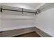 Well-organized walk-in closet featuring built-in shelves and a hanging rod for efficient storage at 175 Jayne Ellen Way, Alpharetta, GA 30009