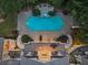 Aerial view of the backyard featuring a large pool and patios with spiral staircases at 510 Covington Cv, Alpharetta, GA 30022