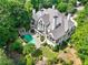 Aerial view of an estate featuring a pool, covered patio, and beautifully landscaped grounds at 510 Covington Cv, Alpharetta, GA 30022