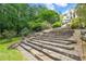 Landscaped yard with stone staircase and plantings up to the home at 510 Covington Cv, Alpharetta, GA 30022