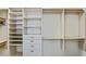 Custom closet with lots of shelving, drawers and hanging storage at 510 Covington Cv, Alpharetta, GA 30022