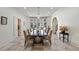 Elegant dining room with large windows, modern lighting, and neutral decor at 510 Covington Cv, Alpharetta, GA 30022