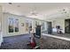 Spacious exercise room with large windows, mirrors, and various fitness equipment at 510 Covington Cv, Alpharetta, GA 30022