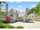 Traditional home with covered portico, porte-cochere, and an attached three car garage at 510 Covington Cv, Alpharetta, GA 30022