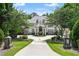 Beautiful home with meticulous landscaping, stone light fixtures, and a circular driveway at 510 Covington Cv, Alpharetta, GA 30022