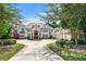 Beautiful home with manicured landscaping, a circular driveway, and a three-car garage at 510 Covington Cv, Alpharetta, GA 30022