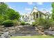 Stunning exterior elevation of home featuring stone steps and professional landscaping at 510 Covington Cv, Alpharetta, GA 30022