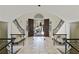 Elegant foyer with dual staircase and views through double doors to landscaped front yard at 510 Covington Cv, Alpharetta, GA 30022