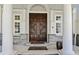 Elegant double front door with sidelights and stone accents create a grand entrance to the home at 510 Covington Cv, Alpharetta, GA 30022