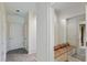 Bright hallway featuring built-in bench seating and tile flooring at 510 Covington Cv, Alpharetta, GA 30022