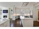 Spacious kitchen with white cabinets, stainless appliances and hardwood floors at 510 Covington Cv, Alpharetta, GA 30022