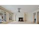 Spacious living room featuring a fireplace, neutral walls, and large glass doors for natural light at 510 Covington Cv, Alpharetta, GA 30022