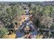 Aerial view of a neighborhood entrance with mature trees and manicured landscaping at 510 Covington Cv, Alpharetta, GA 30022