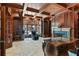 Expansive wood-paneled office with coffered ceilings, custom built-ins, fireplace, and a classic executive desk at 510 Covington Cv, Alpharetta, GA 30022
