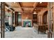 Elegant wood-paneled office with coffered ceilings, custom built-ins, fireplace, and a classic executive desk at 510 Covington Cv, Alpharetta, GA 30022