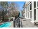 A full view of the pool from the covered patio with outdoor furniture and a barbecue at 510 Covington Cv, Alpharetta, GA 30022