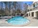 Large swimming pool and outdoor kitchen with view of home at 510 Covington Cv, Alpharetta, GA 30022