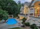 Gorgeous backyard pool with an outdoor kitchen and lounge seating area at 510 Covington Cv, Alpharetta, GA 30022