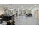 Spacious recreation room with a pool table, wet bar, and ample seating areas at 510 Covington Cv, Alpharetta, GA 30022