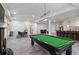 Open recreation room with pool table, bar area, and comfortable seating arrangements at 510 Covington Cv, Alpharetta, GA 30022