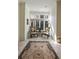 Cozy sitting area bathed in natural light, featuring elegant chairs, a decorative rug, and a serene view of the outdoors at 510 Covington Cv, Alpharetta, GA 30022