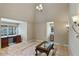 Sitting room with decorative sconces, a writing desk and a bay window at 510 Covington Cv, Alpharetta, GA 30022