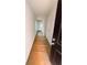 Bright hallway with white walls, leading to a room with natural light at 11612 E Lovejoy Rd, Hampton, GA 30228