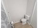 Modern bathroom with a white toilet, decorative shower curtain and light wood floors at 208 Willows Ct, Riverdale, GA 30274