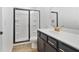 Stylish bathroom featuring a glass-enclosed shower, sleek vanity with modern fixtures, and contemporary design at 2109 Stillhaven Pl, Douglasville, GA 30135