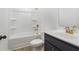 Bright bathroom featuring a shower-tub combo, modern vanity with gold fixtures, and contemporary design at 2109 Stillhaven Pl, Douglasville, GA 30135