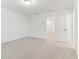 Light-filled bedroom with soft carpeting, and a doorway, offering comfort and style at 2109 Stillhaven Pl, Douglasville, GA 30135