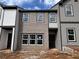 Exterior of new townhomes with brick and gray siding at 2109 Stillhaven Pl, Douglasville, GA 30135