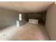 Kitchen space with base cabinets and island, awaiting completion in a new home at 35 Emerald Ln, Covington, GA 30014