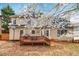 Backyard view of two-story home with a deck, grill, and basketball hoop at 3770 Summit Gate Dr, Suwanee, GA 30024