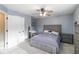 Bedroom featuring gray walls, carpet, ceiling fan, and an upholstered bed at 3770 Summit Gate Dr, Suwanee, GA 30024