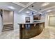 Basement bar area featuring tile flooring, custom bar, and stainless steel refrigerator at 3871 River Mansion Dr, Peachtree Corners, GA 30096